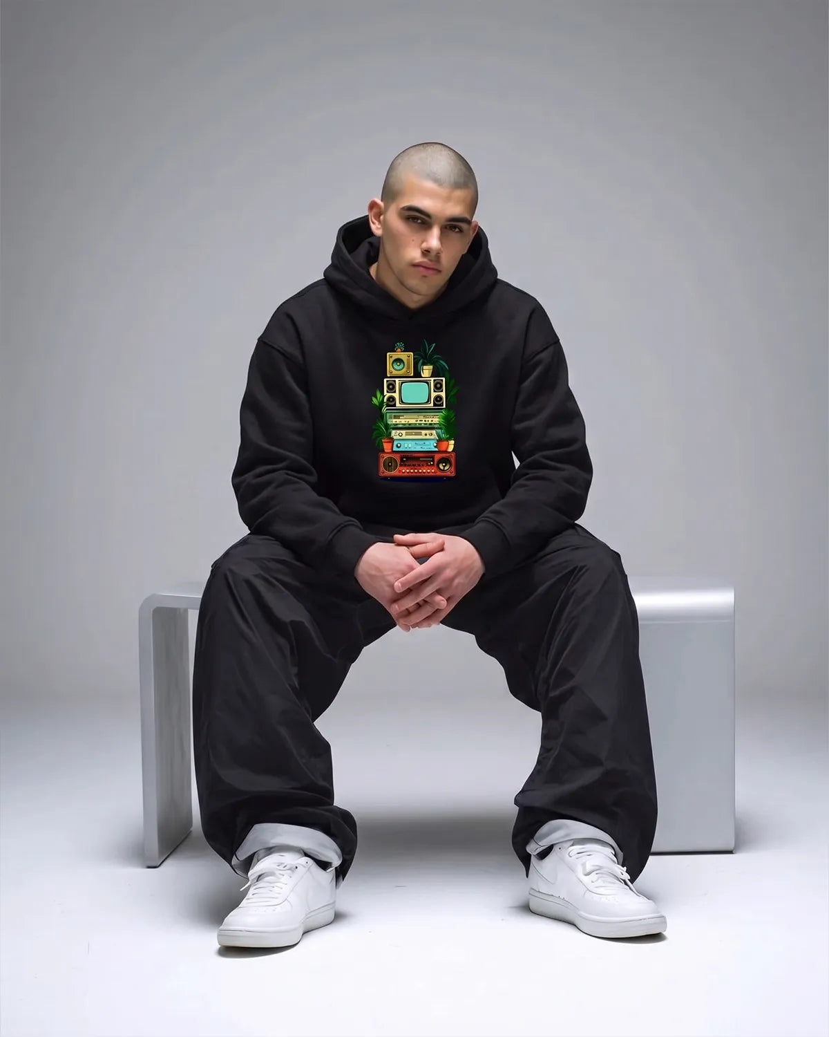 Vintage retro tech graphic hoodie featuring nostalgic artwork, adjustable hood, and relaxed fit for everyday streetwear.