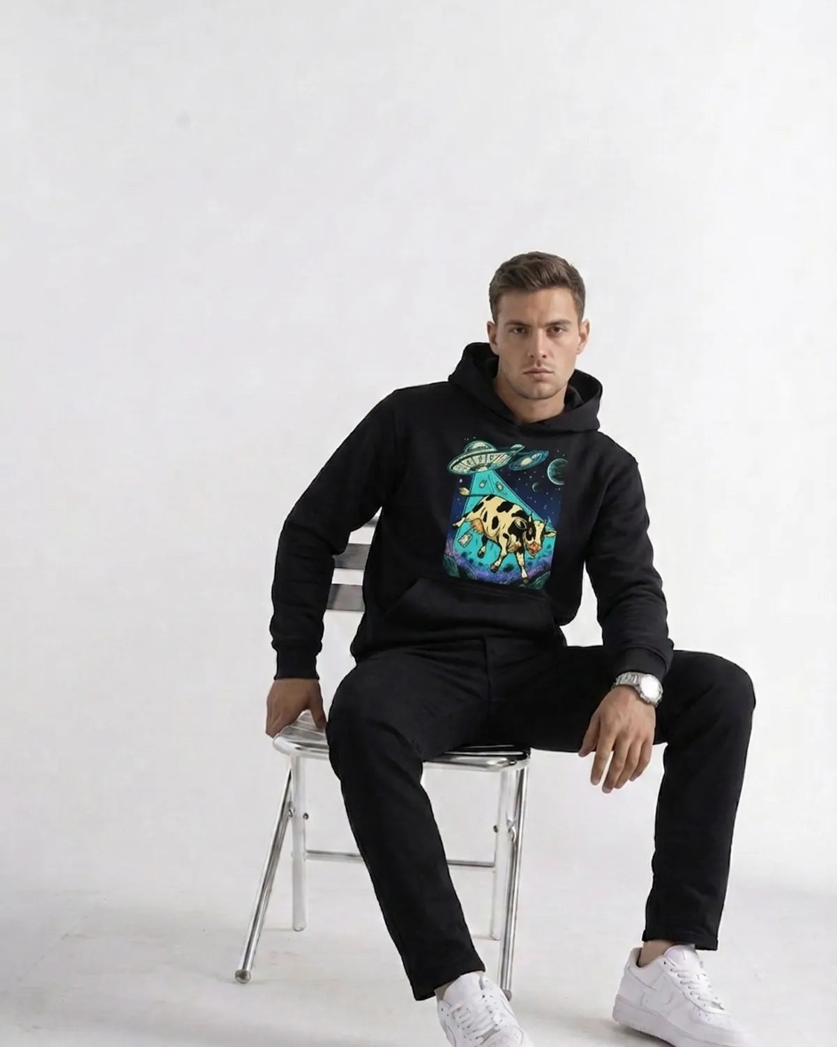 Space-inspired cow hoodie with eye-catching cosmic artwork, adjustable hood, and relaxed fit for casual fashion.